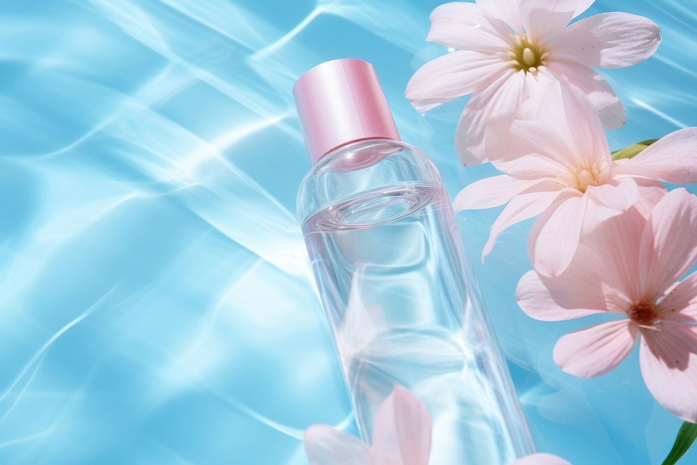 Skincare bottle on water floor pattern cosmetics perfume flower.