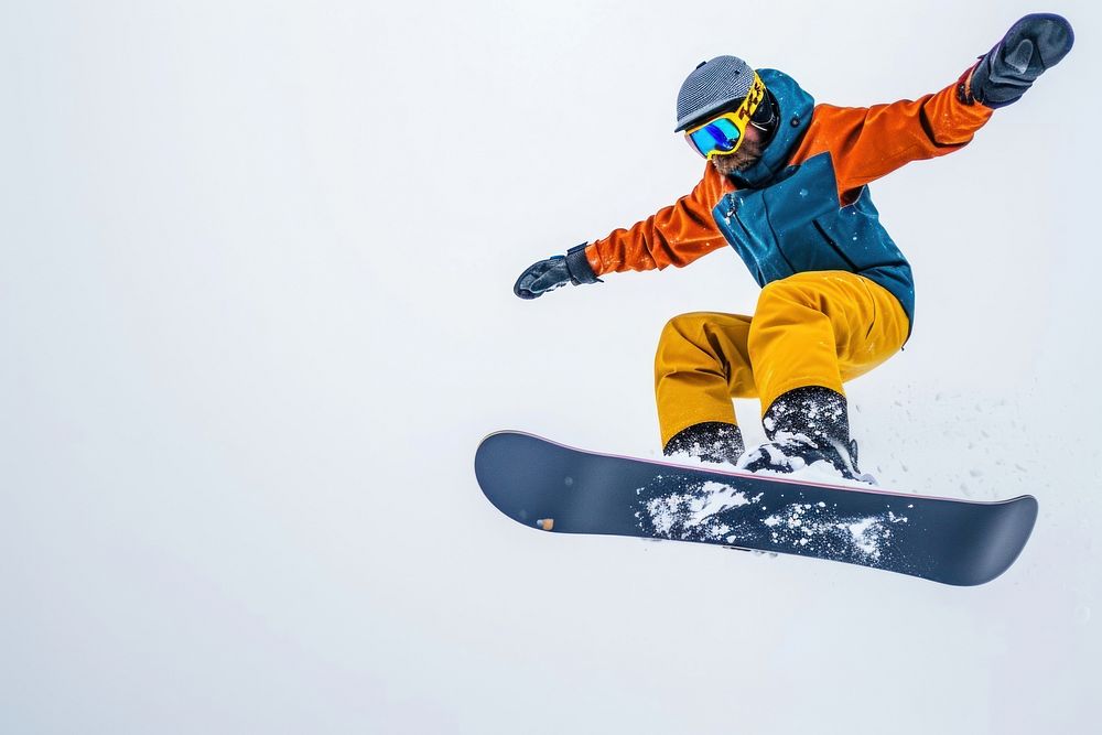 Snowboarder jumping through air snow snowboarding recreation.