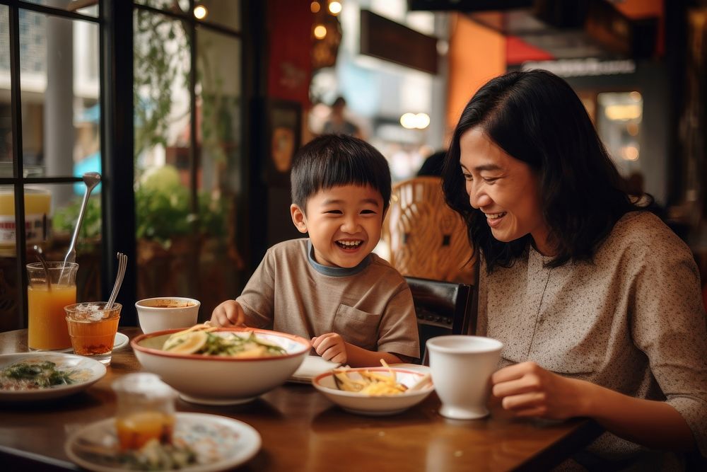 Thai family eat noodle restaurant child adult.