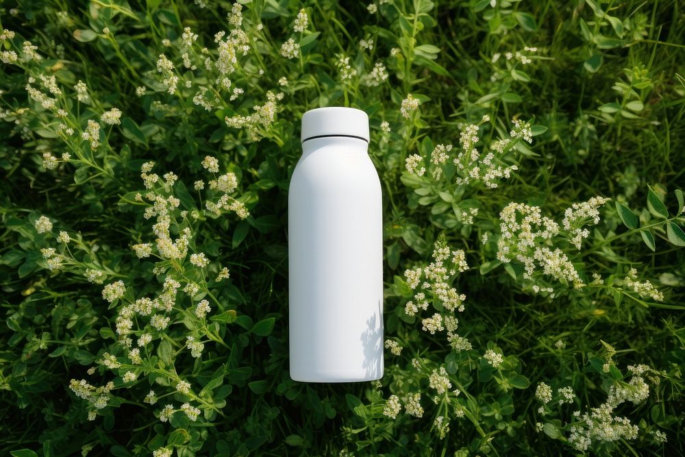Water bottle packaging  flower plant grass.