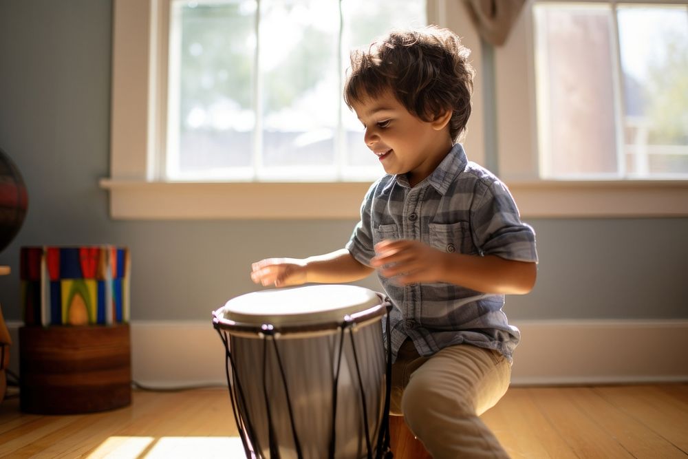 Hispanic boy playing drum drums percussion child.