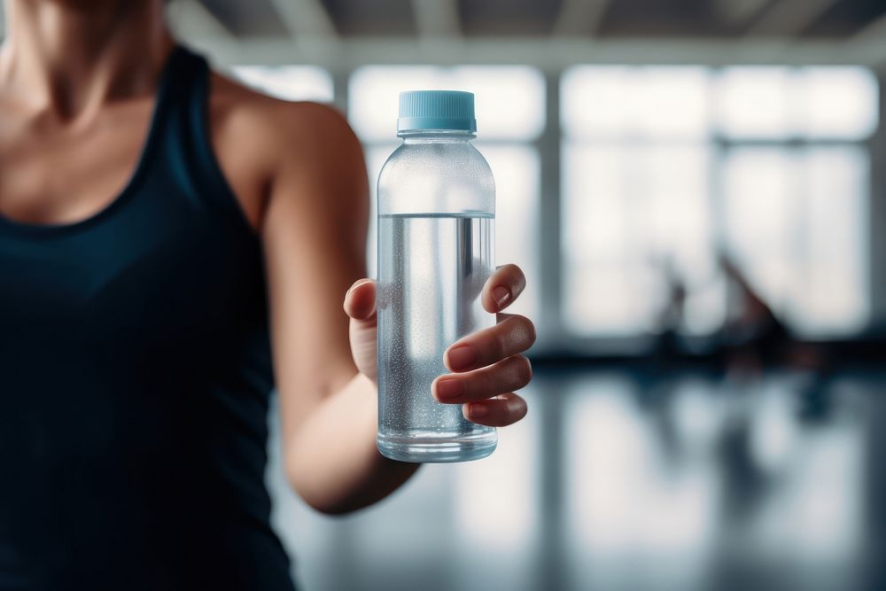 Bottle of water holding hand gym.