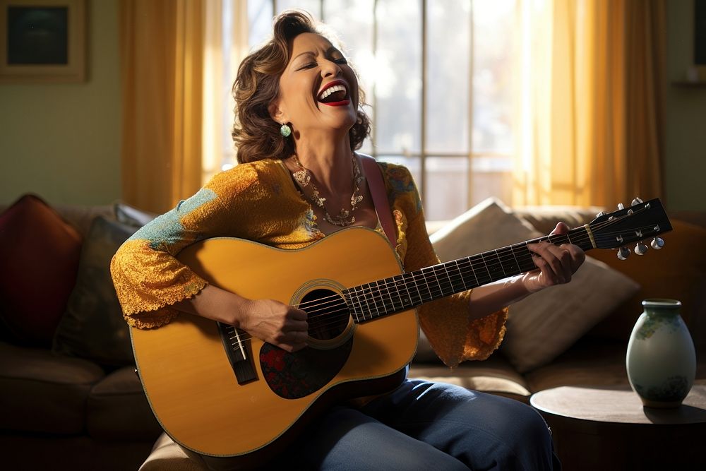 Woman in her 50s laughing musician guitar.