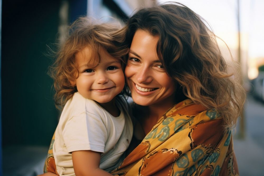 Woman and kid laughing portrait hugging. AI generated Image by rawpixel.