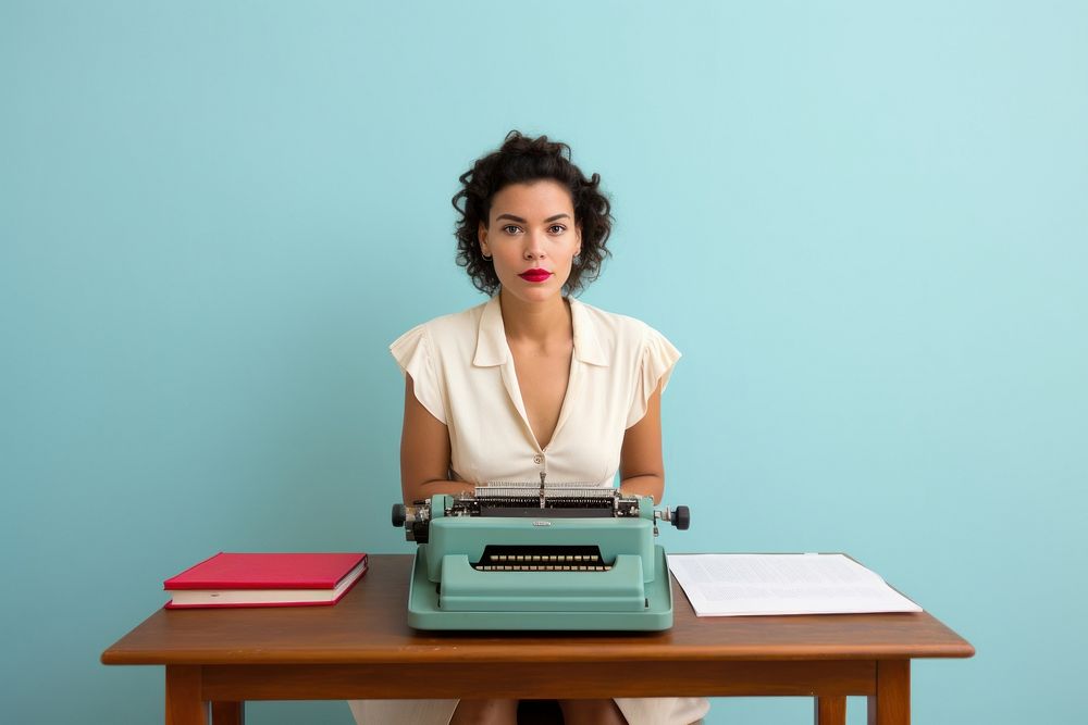 Woman with a typewriter table adult desk.
