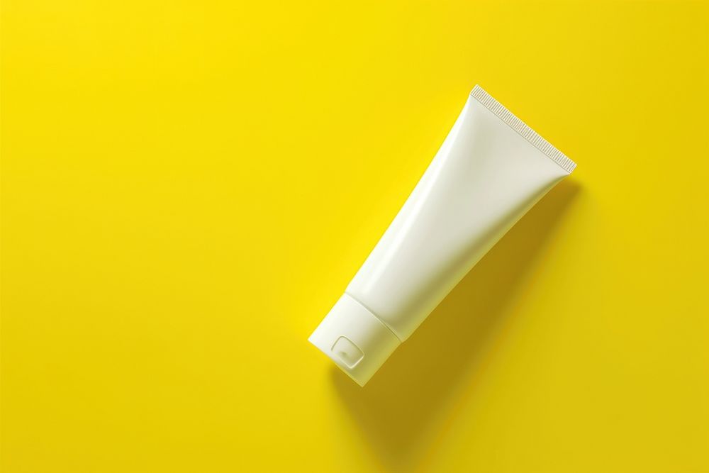 Cream tube packaging  yellow yellow background cosmetics.