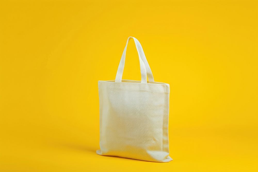 Tote bag packaging  yellow handbag yellow background.