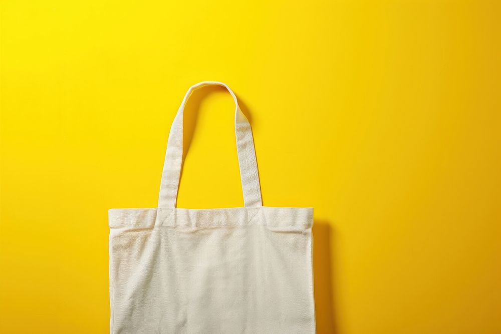 Tote bag packaging  handbag yellow yellow background.