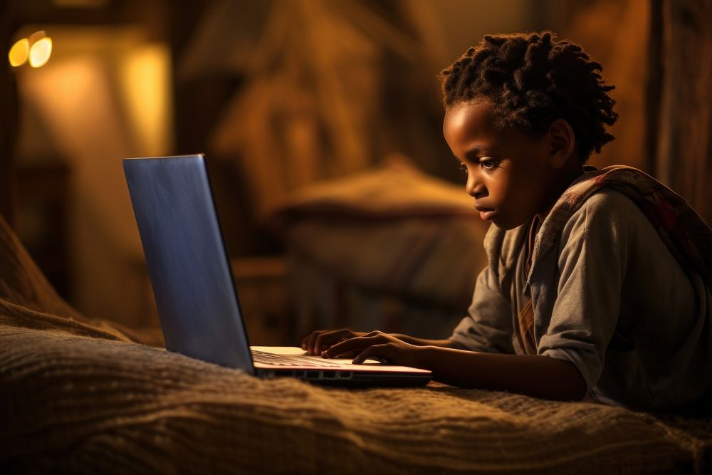 African kid computer reading working.