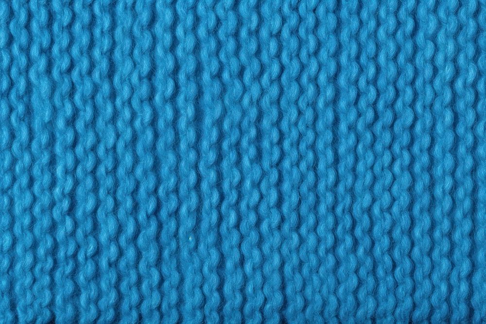 Blue wool knit backgrounds texture repetition.
