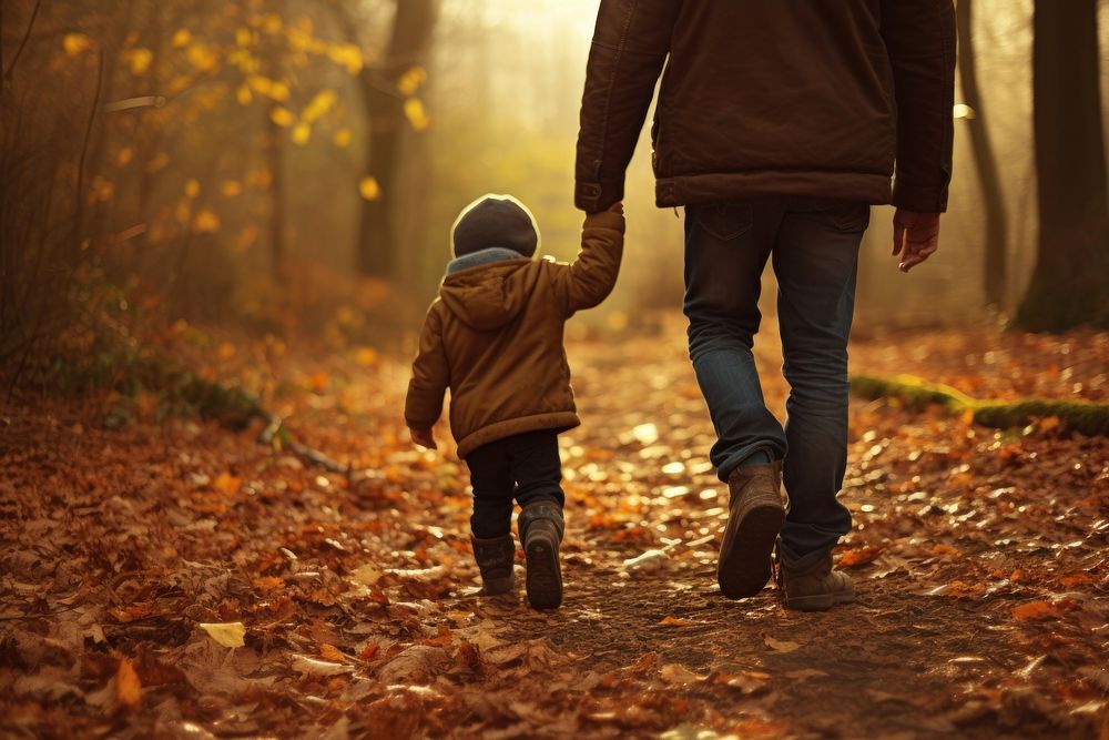 Kid hand holding man hand walking autumn child.