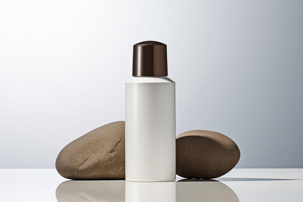 Polished bottle with dispenser  cosmetics perfume studio shot.