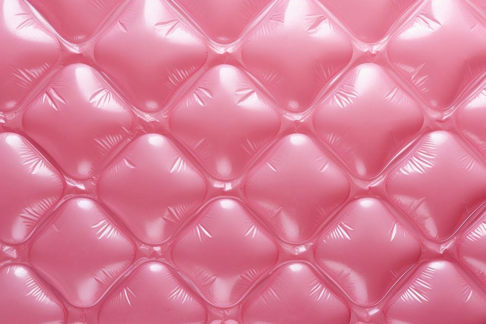 A pink heart shaped pattern plastic bubble wrap backgrounds repetition textured.