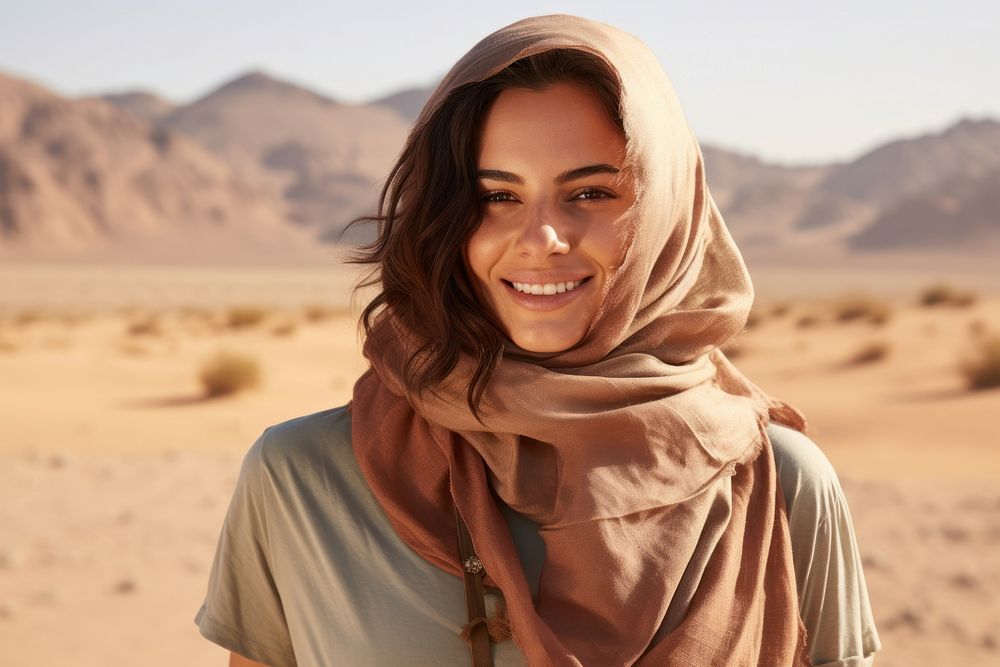 Middle East joyful woman portrait outdoors desert.