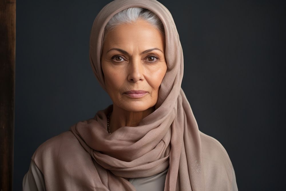 Middle East senior woman portrait hijab scarf.