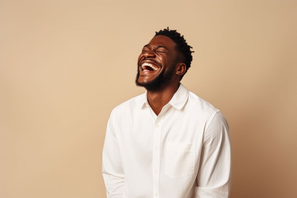 Black man laughing adult studio shot.