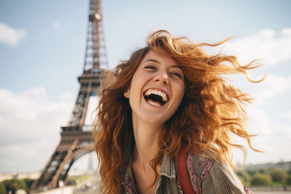 Happy young woman enjoying in front of eiffel tower laughing smile happy.