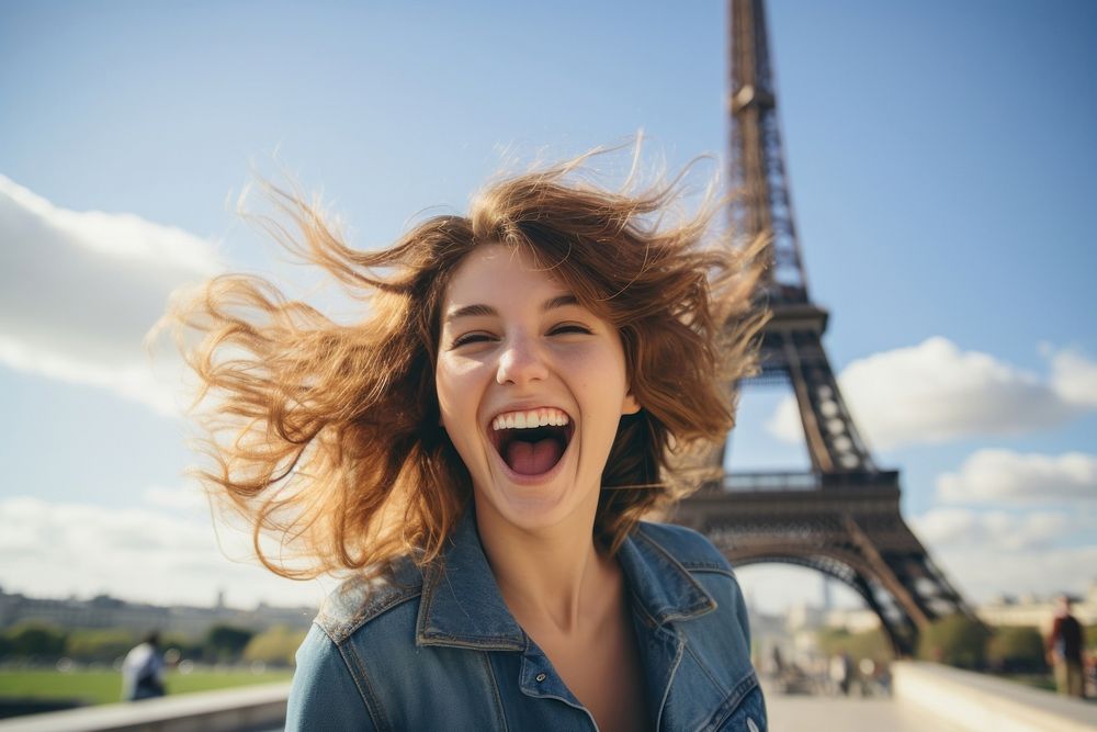 Happy young woman enjoying in front of eiffel tower laughing adult happy.