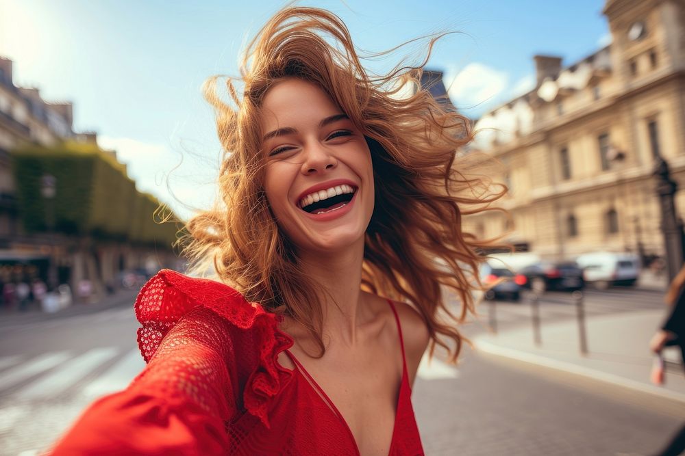 Happy young woman in red dress taking selfie laughing smile adult.