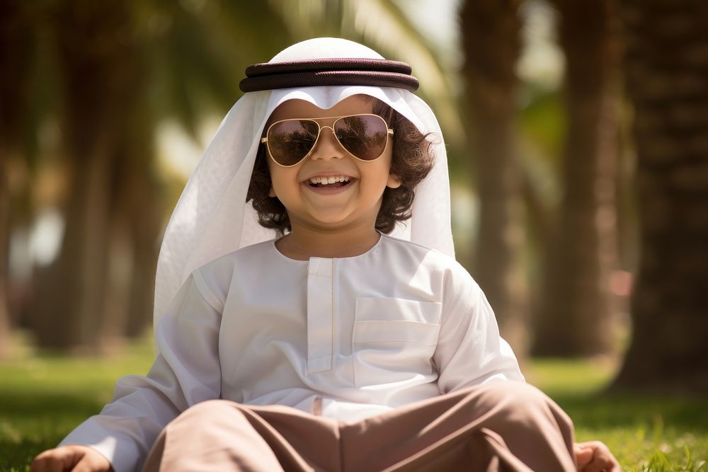 Qatari kid glasses summer smile.