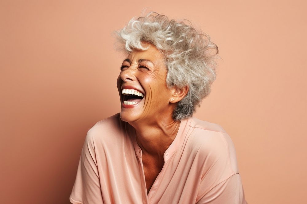 Black senior woman laughing adult studio shot.