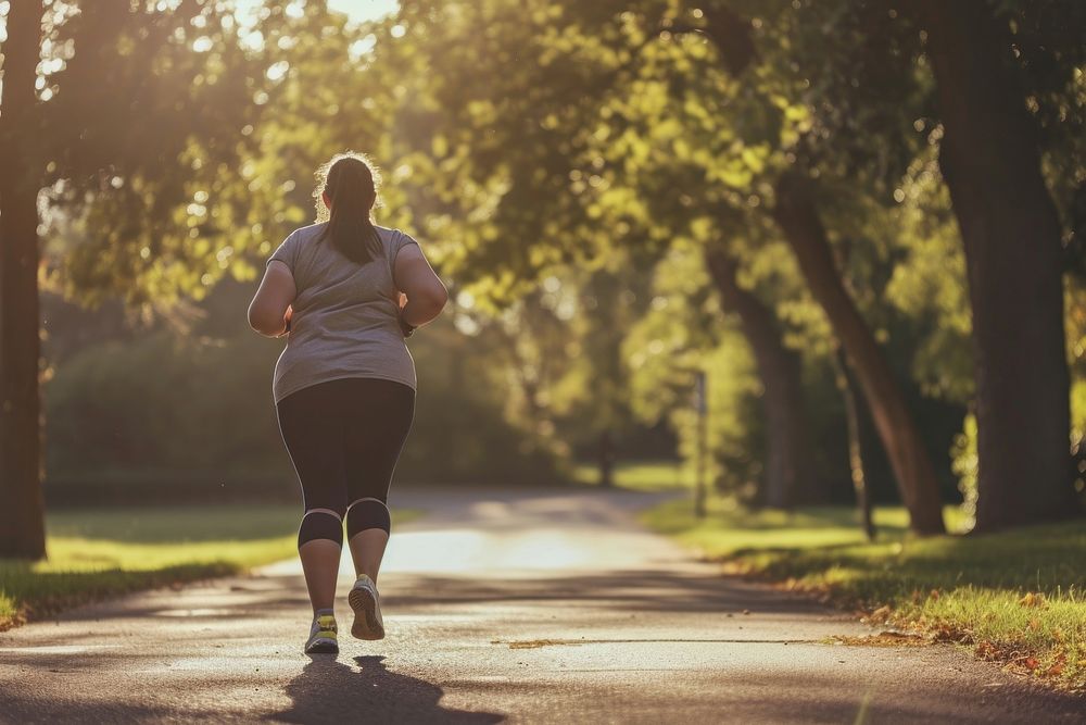 Fat woman jogging running adult exercising.