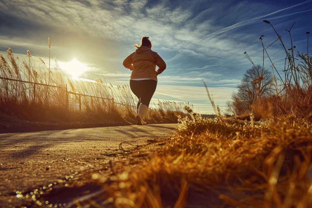 Fat woman jogging running exercising landscape.