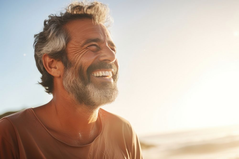 Mature middle eastern man enjoying surfing smiling adult smile.