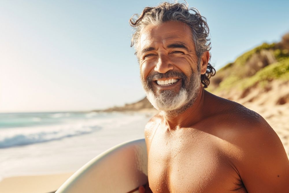 Mature middle eastern man enjoying surfing smiling summer adult.