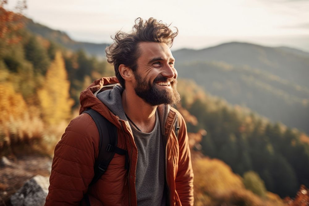 Middel eastern man hiking mountain portrait smiling.