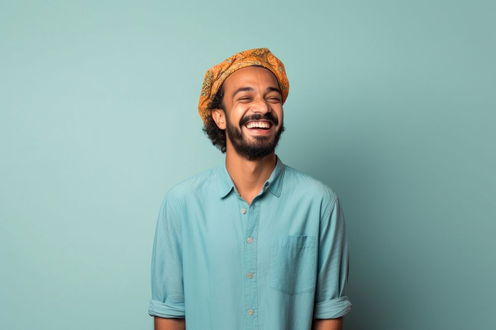 Middle eastern man in summer outfit portrait laughing smiling.