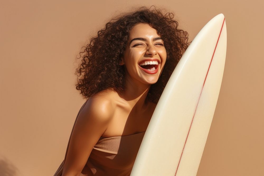 Middle eastern girl enjoying surfing laughing smiling summer.