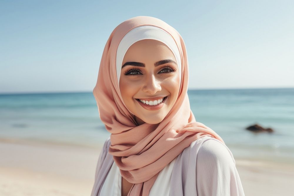 Middle eastern woman enjoy summer at the beach smiling scarf smile.