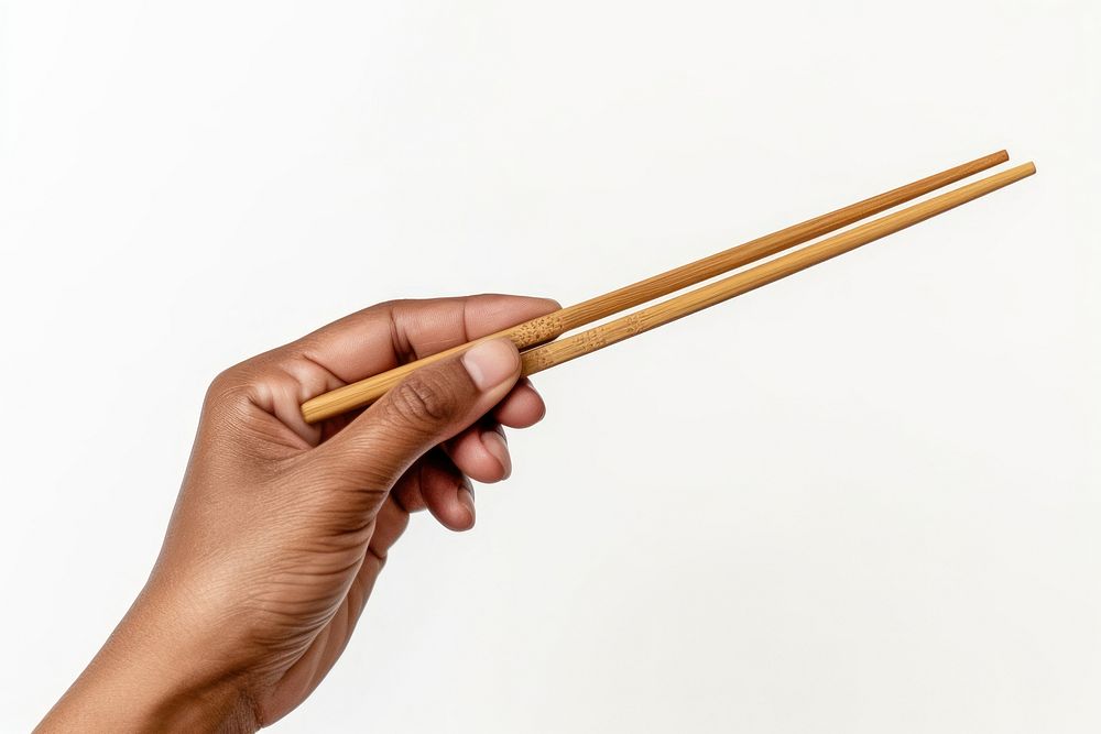 Hand using wood chopsticks white background holding finger.