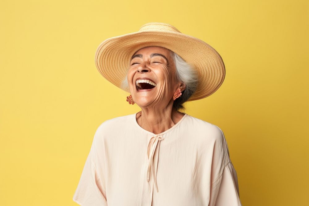 Mexican senior woman laughing adult studio shot.