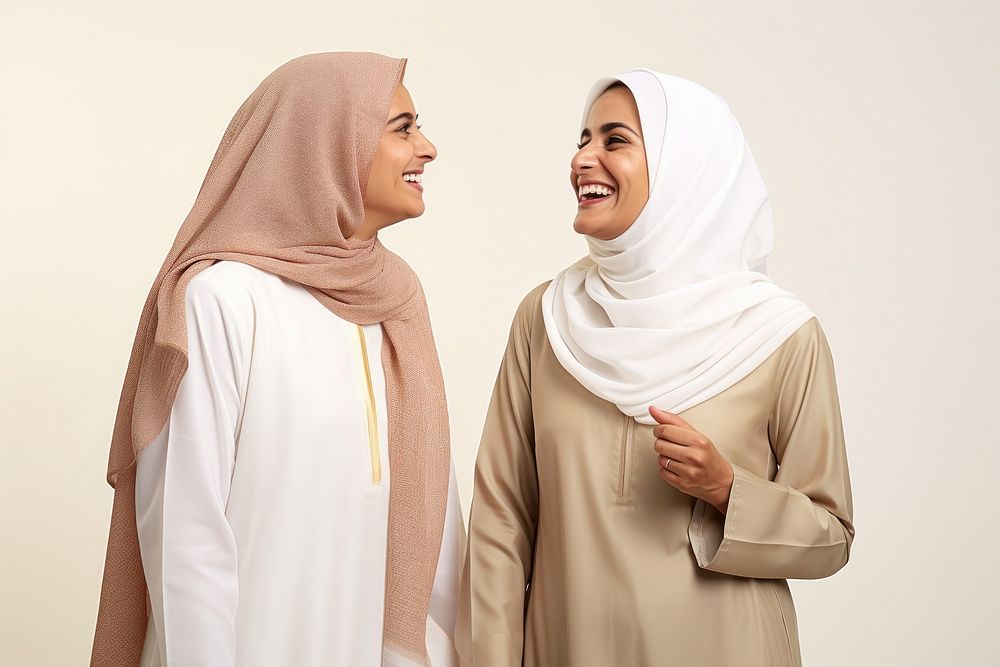 Qatari middle age woman friends talking together cheerful laughing adult.