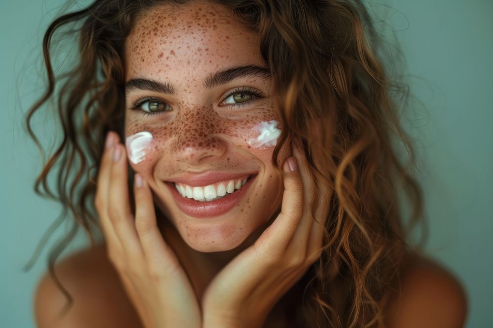 Latina Brazilian girl smile skin applying.