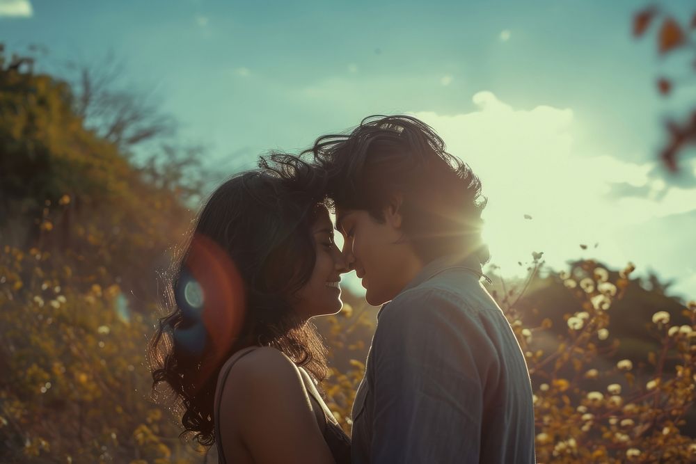 Indian lover outdoors portrait kissing.