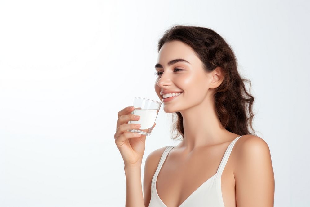 Young woman holding glass of water drinking adult smile.