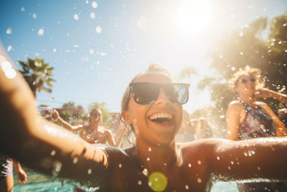 Pool sunglasses swimming laughing.