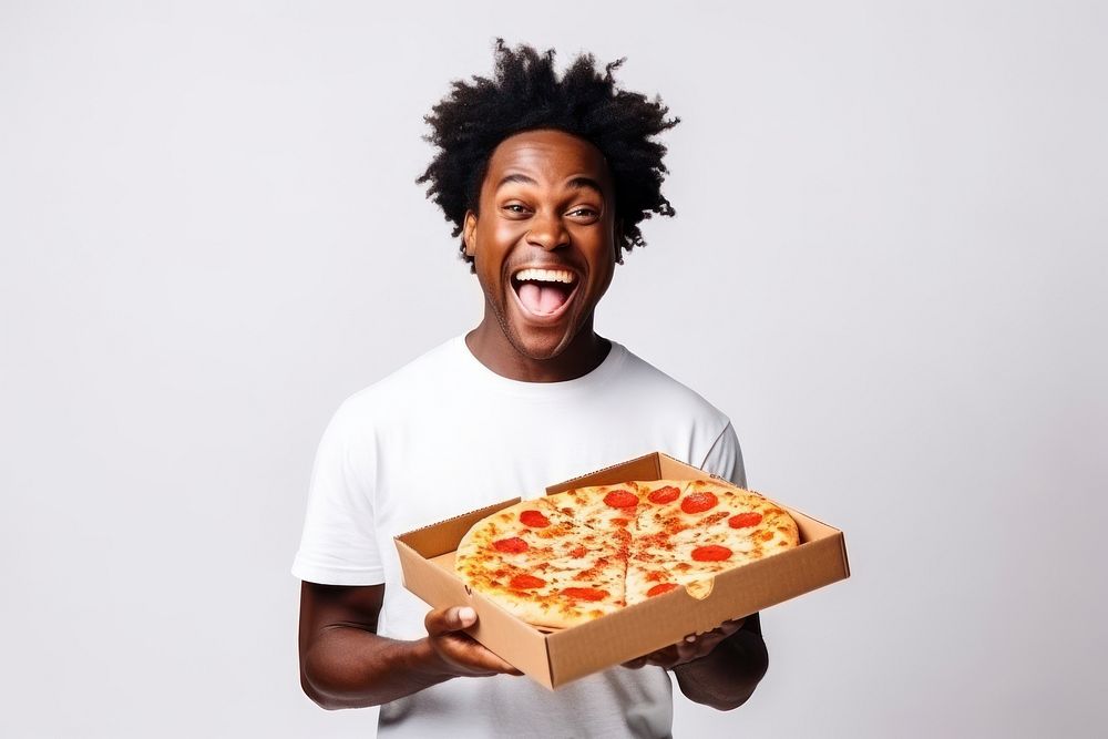 Joyful african american man in white t-shirt holds box of pizza food adult fast food.