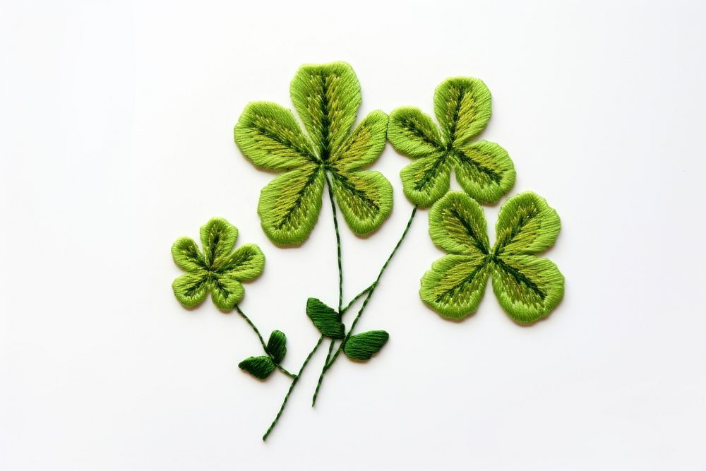 Clover in embroidery style plant green herbs.