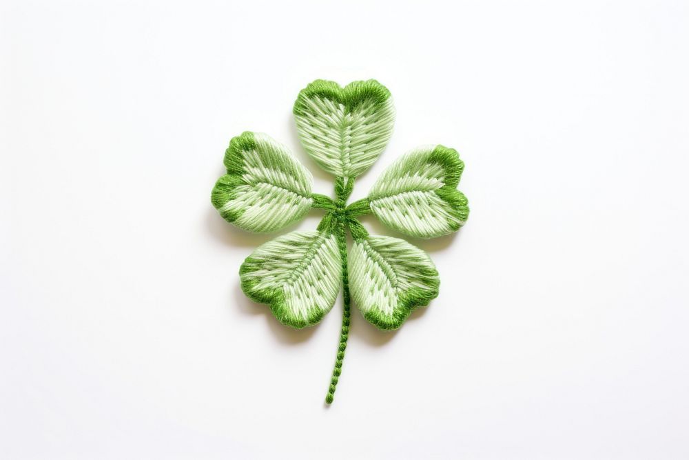 Clover in embroidery style pattern plant green.