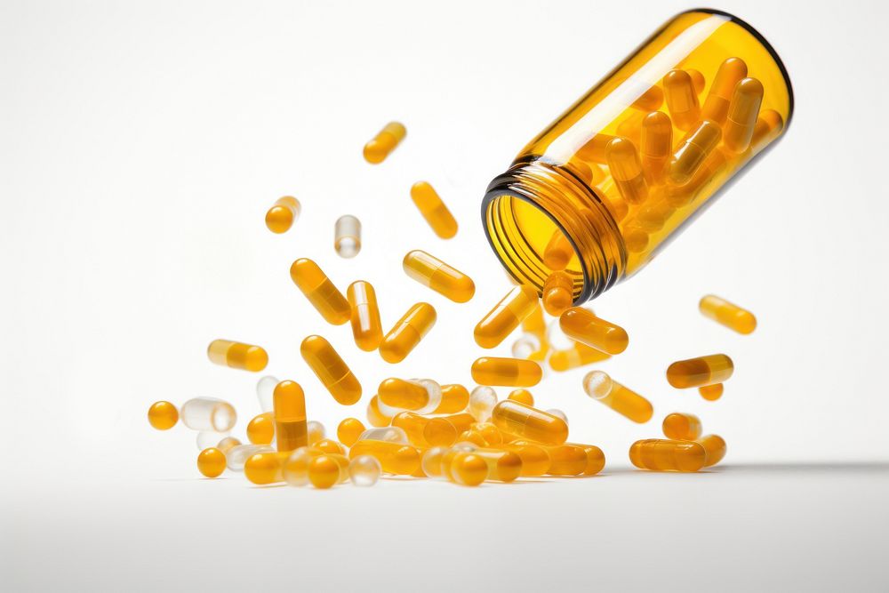 Capsules spilling bottle white background medication. AI generated Image by rawpixel.