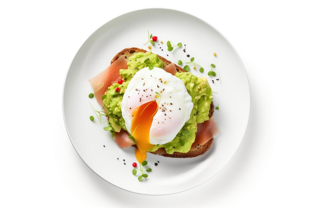 Poached egg with salmon and guacamole on rye bread plate food white background.