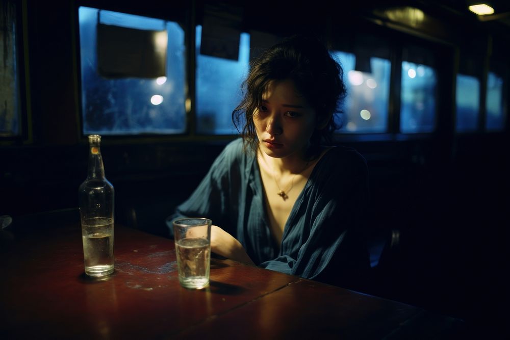 Young female crying in the bar table photography portrait.