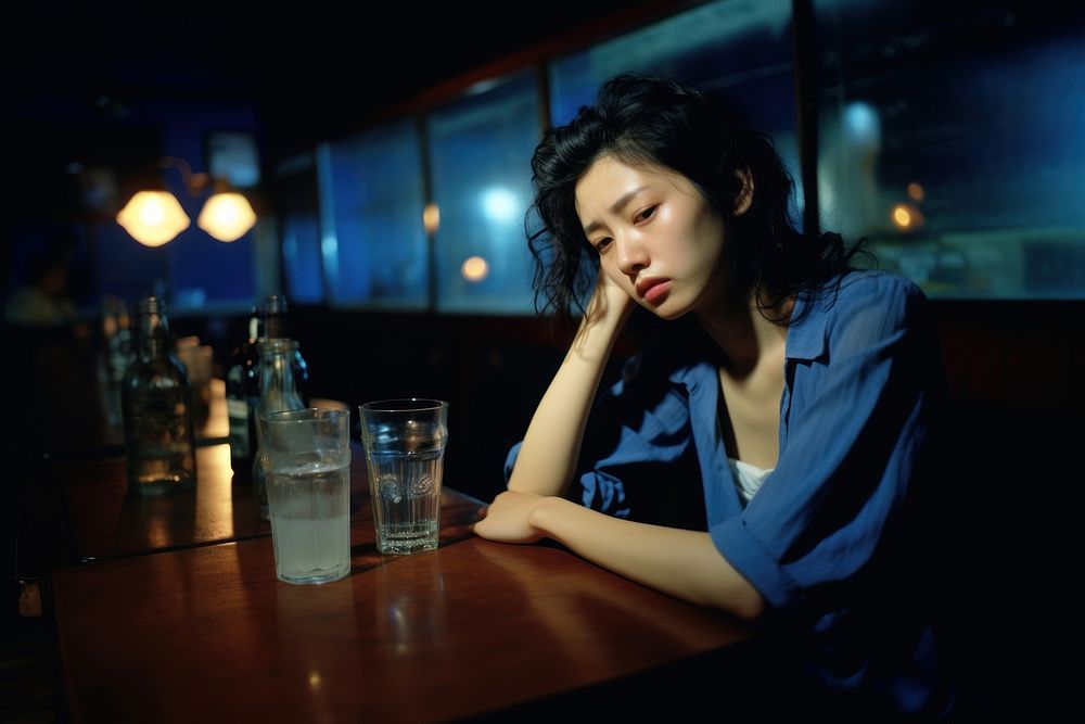 Young female crying in the bar worried table adult.