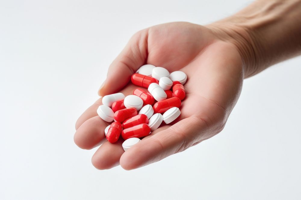 Pills holding hand antioxidant. AI generated Image by rawpixel.