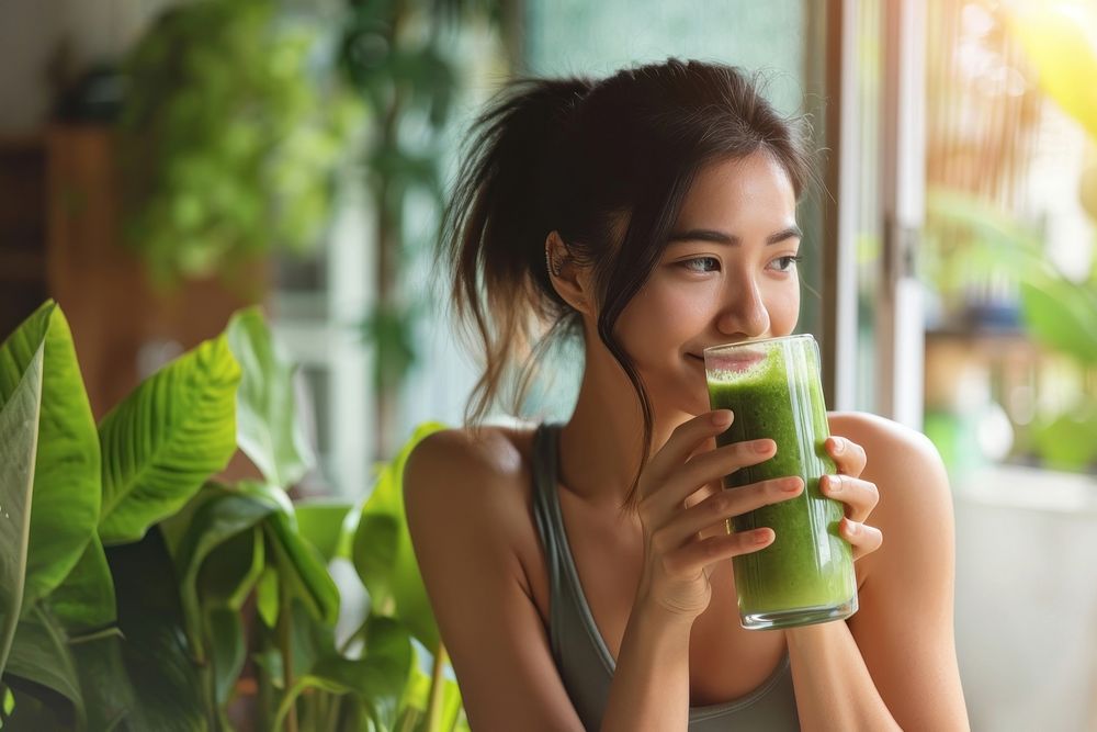 Native asian woman drinking green smoothie person day refreshment. AI generated Image by rawpixel.