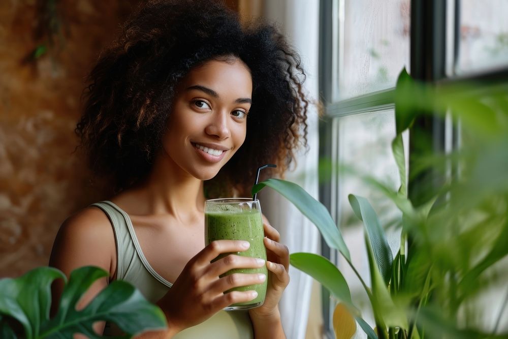 Native asian woman drinking green smoothie person smile day. AI generated Image by rawpixel.